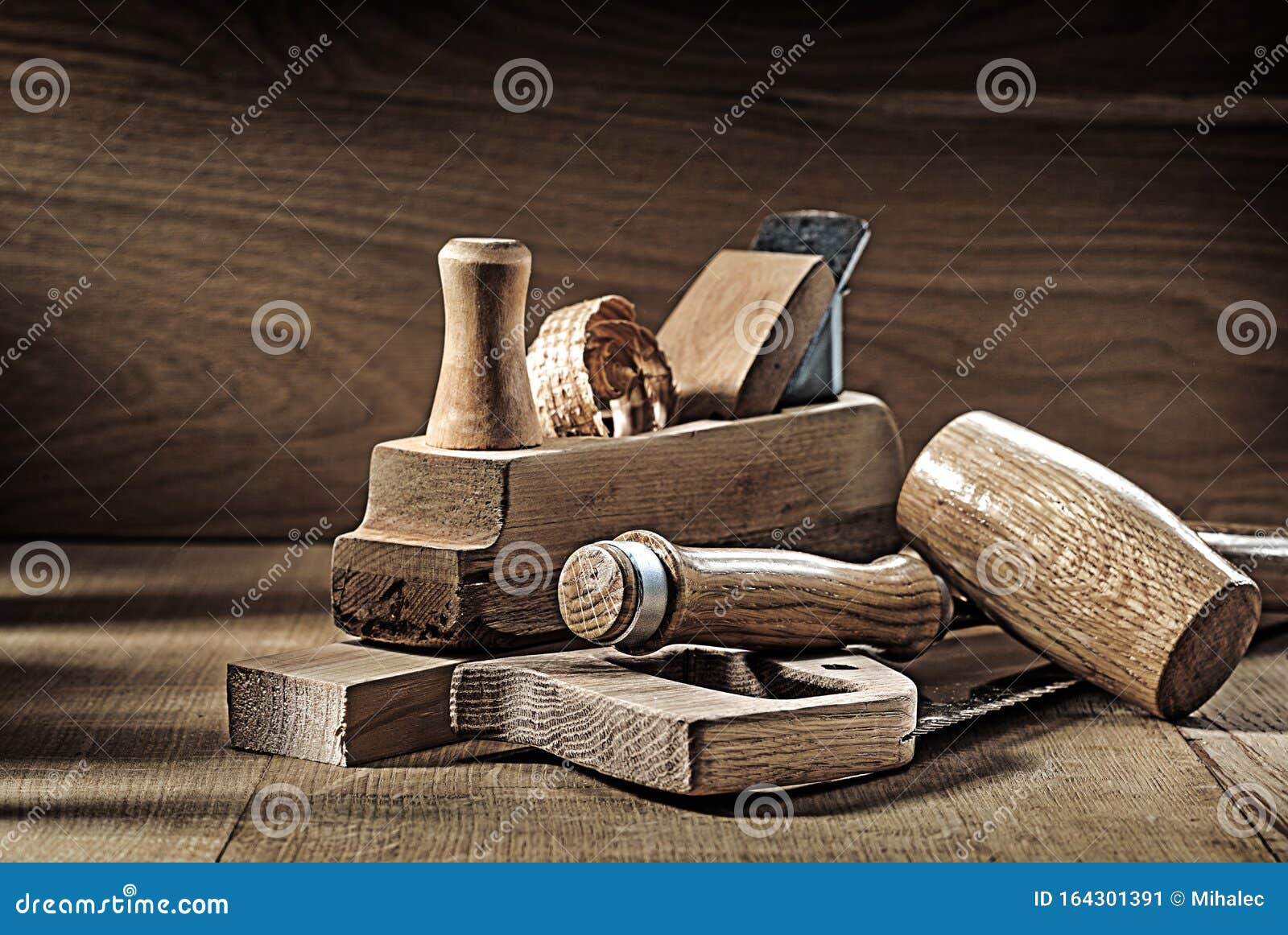 carpenter tools woodworkers plane handsaw chisel mallet on vintage wood background