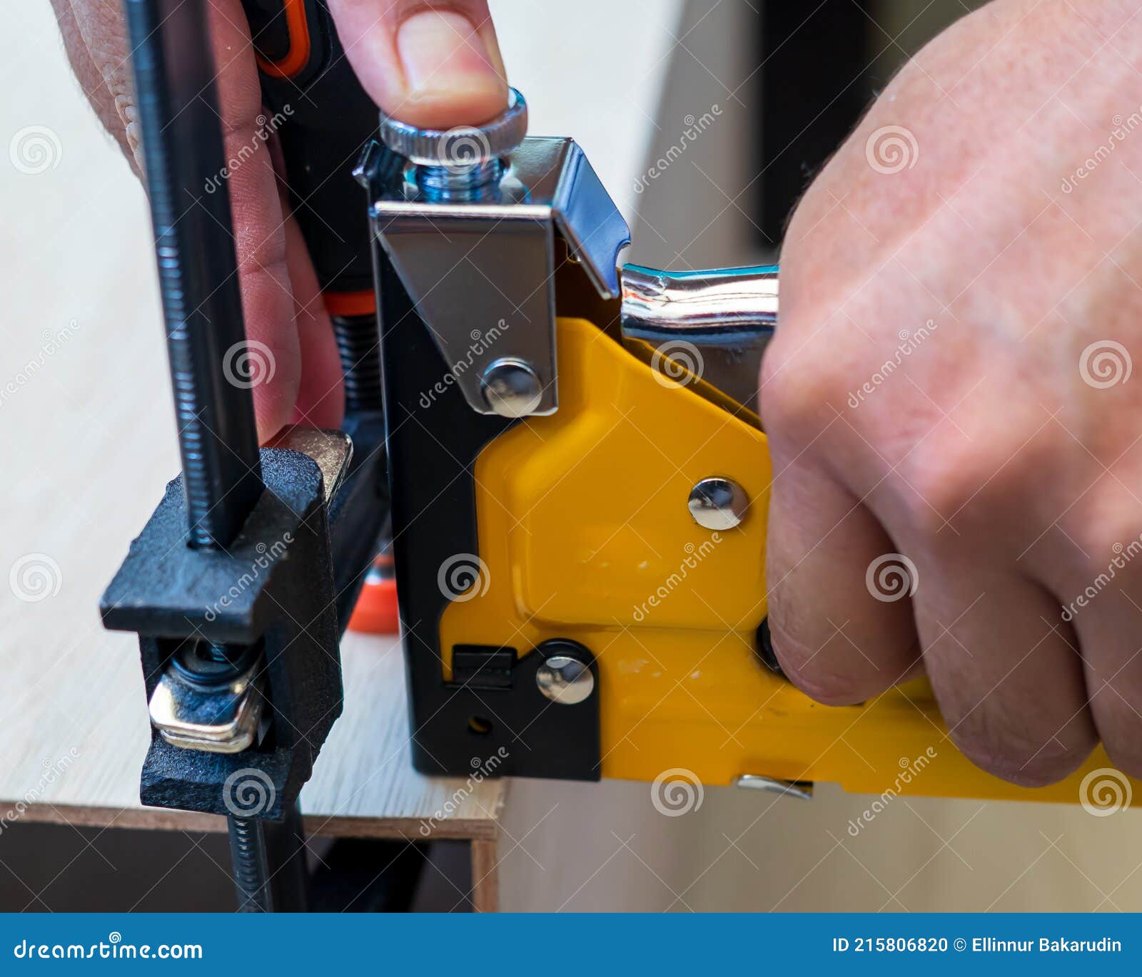 Carpenter Using an Industrial Construction Stapler on a Wood Plank Stock  Photo - Image of furniture, construction: 215806820