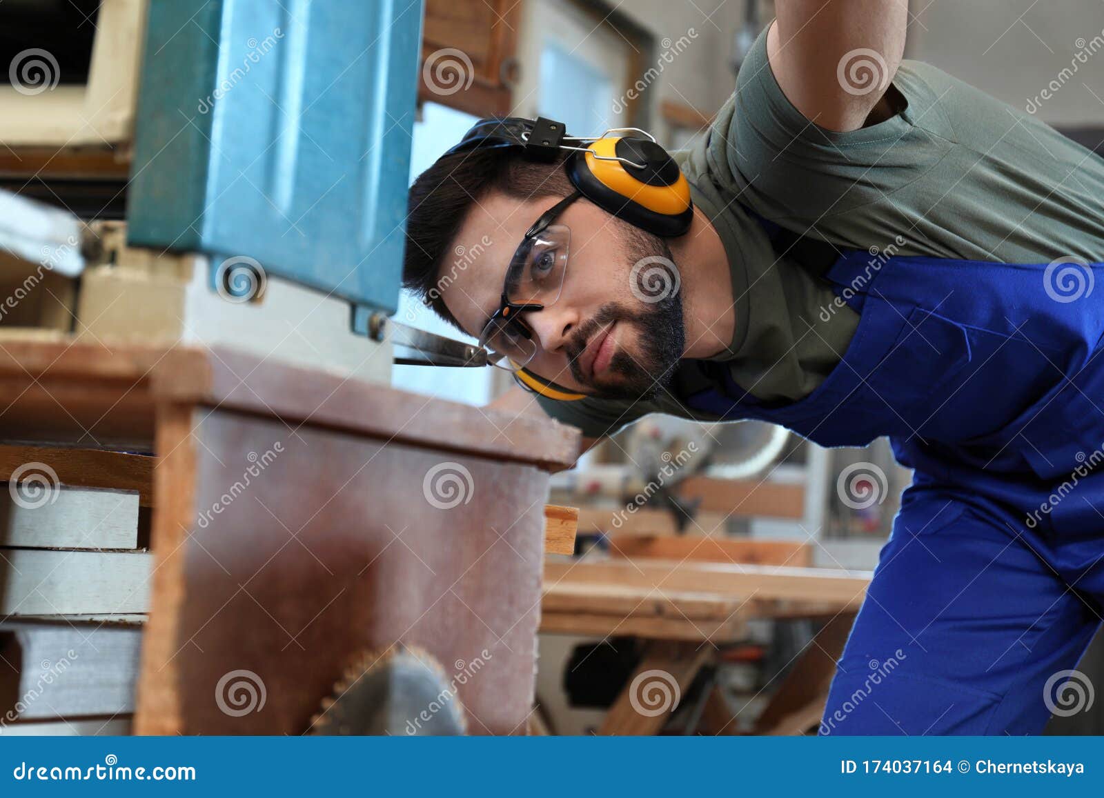 Carpenter Working with Grinding Machine in Shop Stock Photo Image of