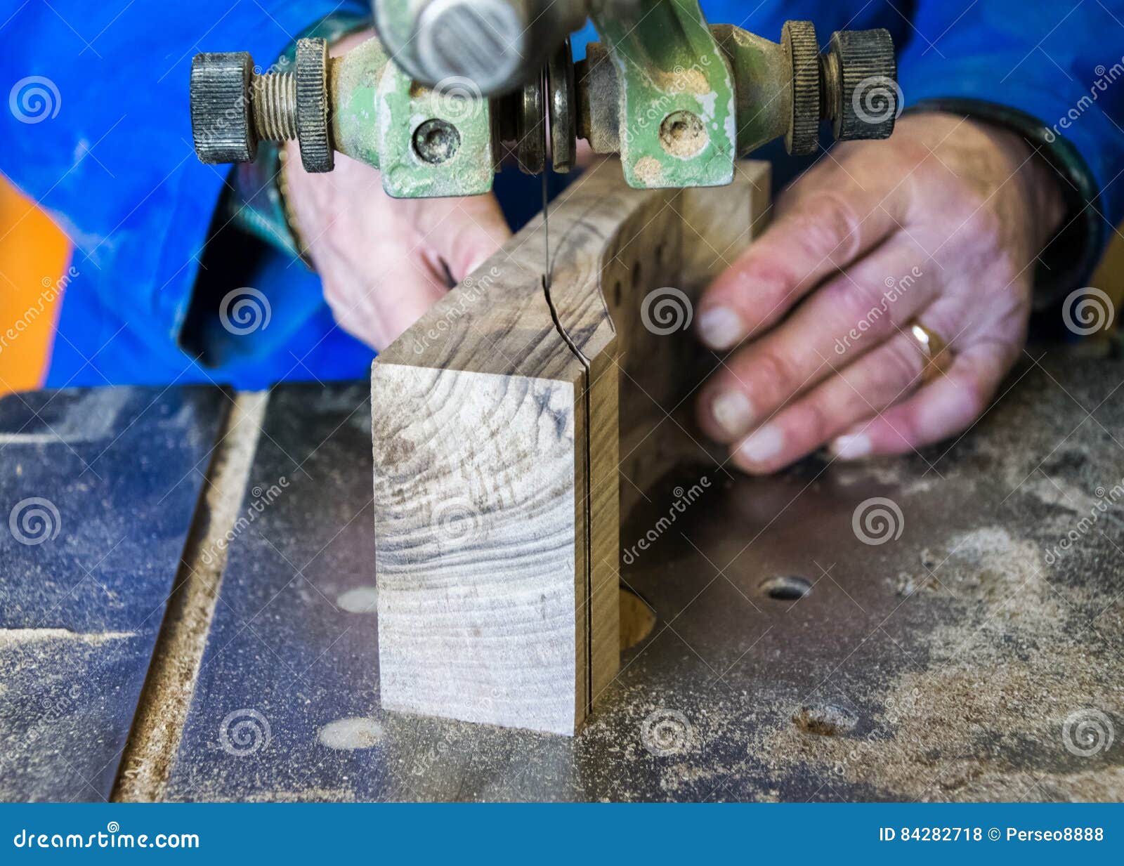 Carpenter Workplace Carpenter Workplace. Man Using Saw To Cut Wood