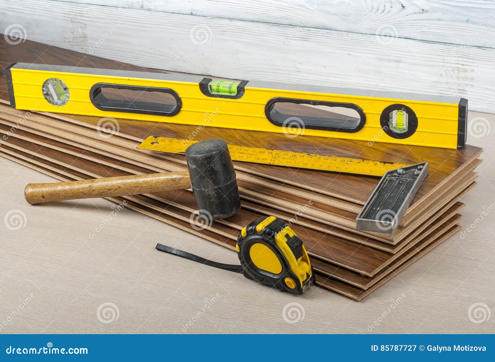 Carpentry Concept.Different Tools on the New Laminate Flooring.Copy