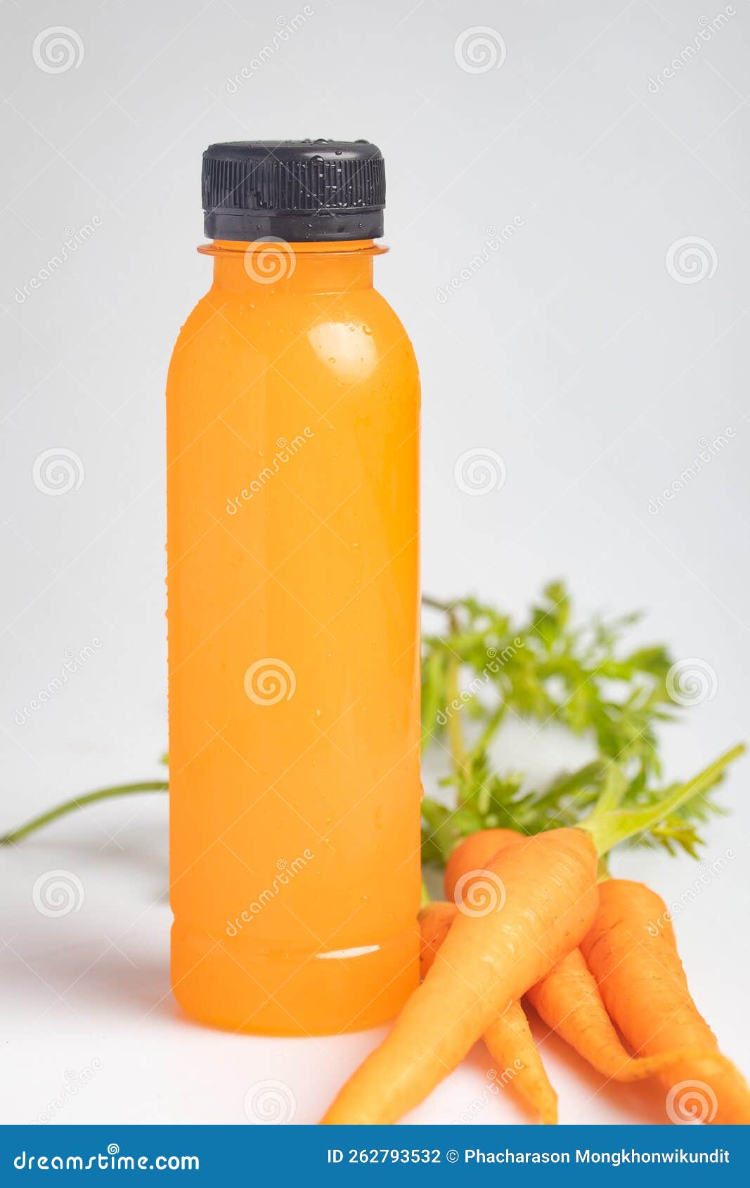 Carrot Juice in a Clear Plastic Bottle. Healthy Drink Stock Photo