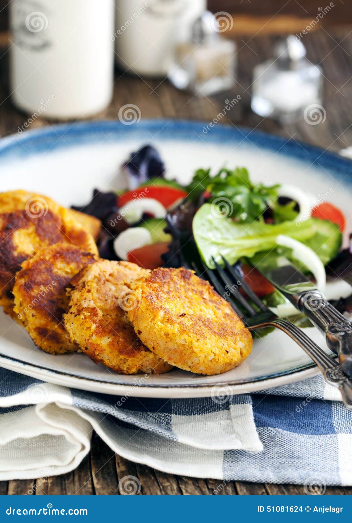 Carrot and potato pancakes stock photo. Image of garnish 51081624