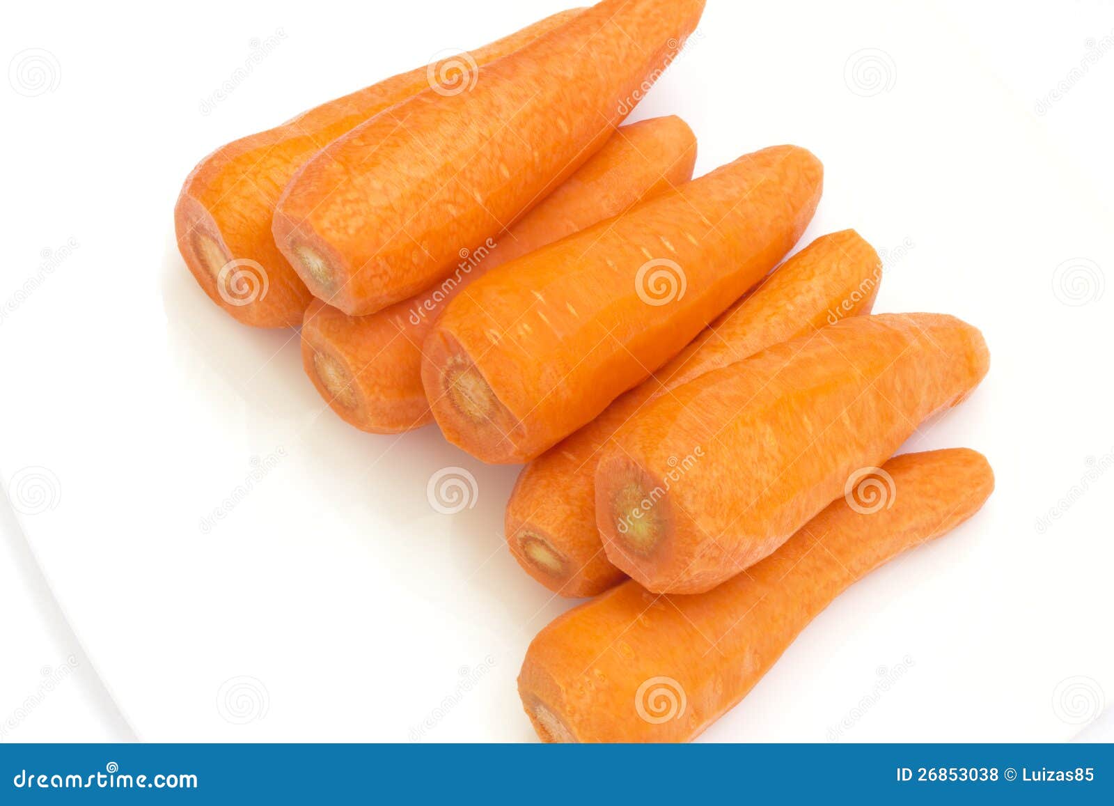 Carrots in a bowl. Many red carrots on a white plate