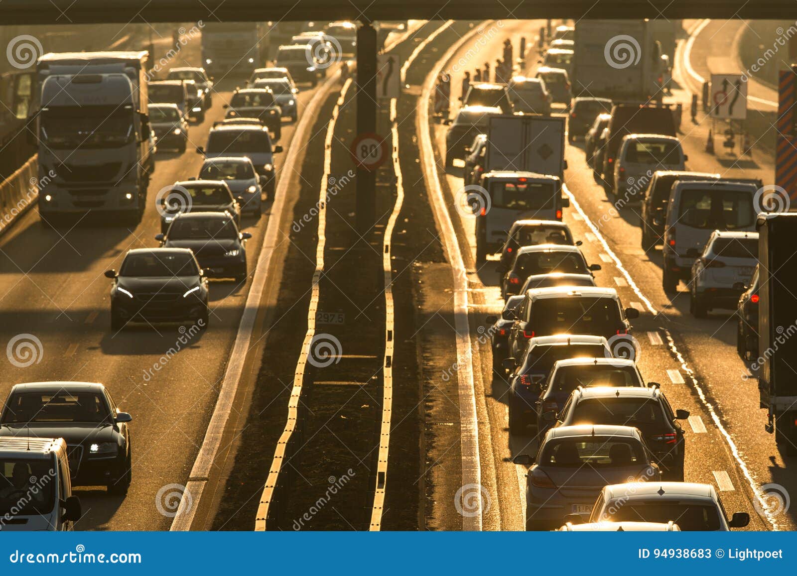 cars going very slowly in a traffic jam during the morning rushhour