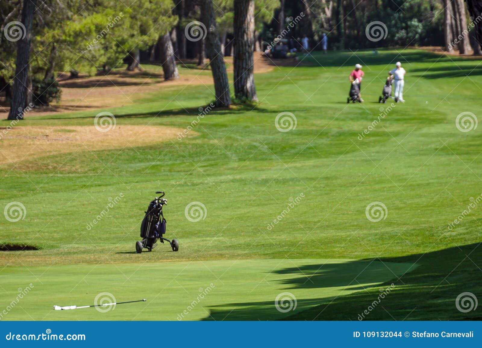 Cart To Bring the Golf Clubs on the See Golf Course Stock Photo Image