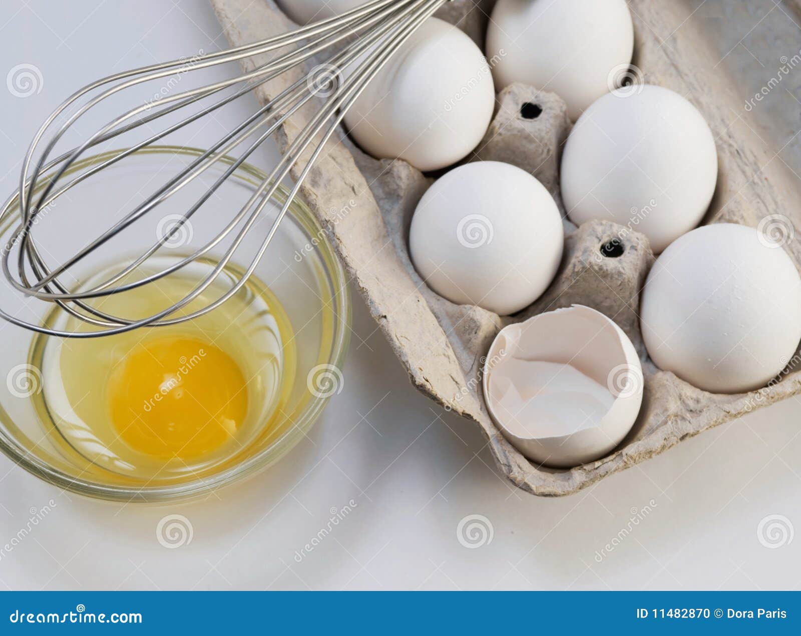 carton of eggs with whisk