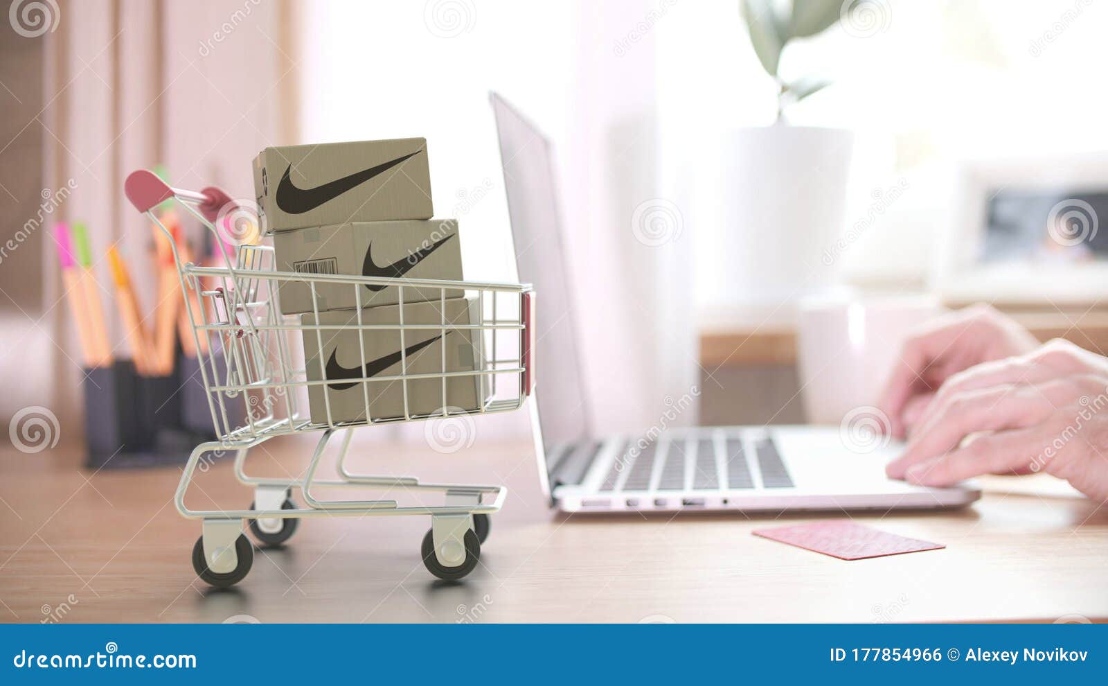 entregar Preservativo Medio Cartons with NIKE Logo in Shopping Trolley Near Customer with Laptop.  Editorial Online Shopping from Home 3D Rendering Editorial Photo - Image of  nike, logistics: 177854966