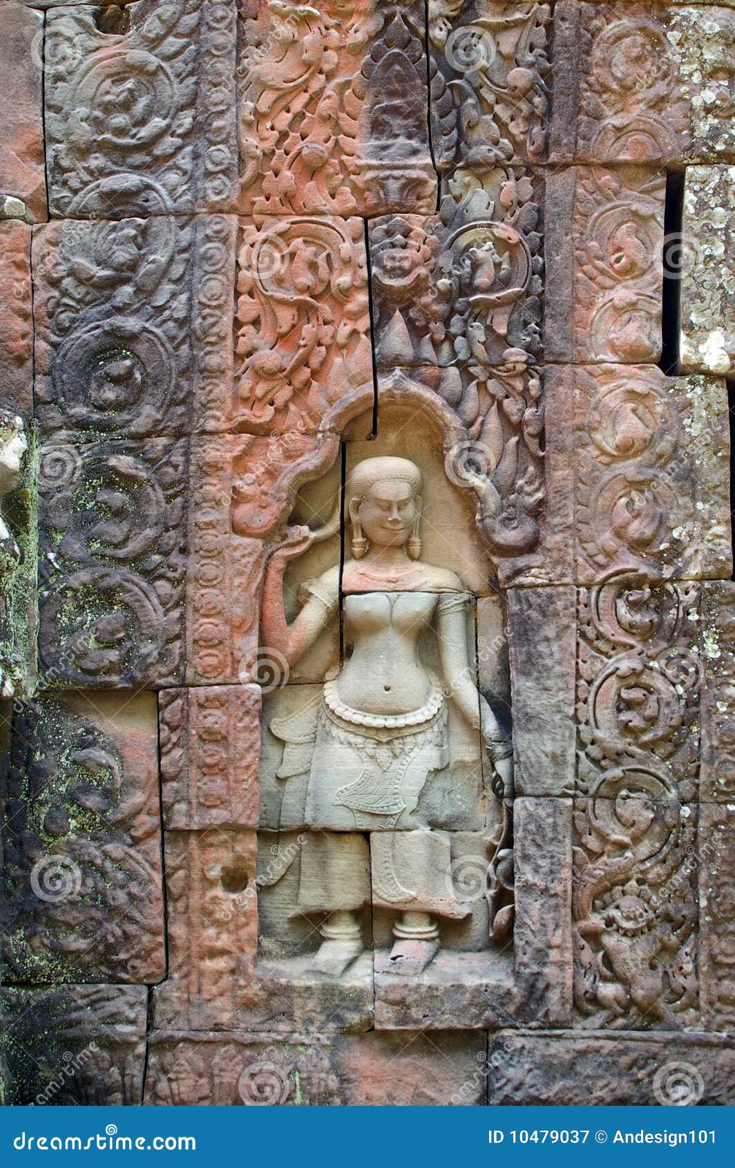 Carved color. Carved traditonal woamn in cambodian ta som temple