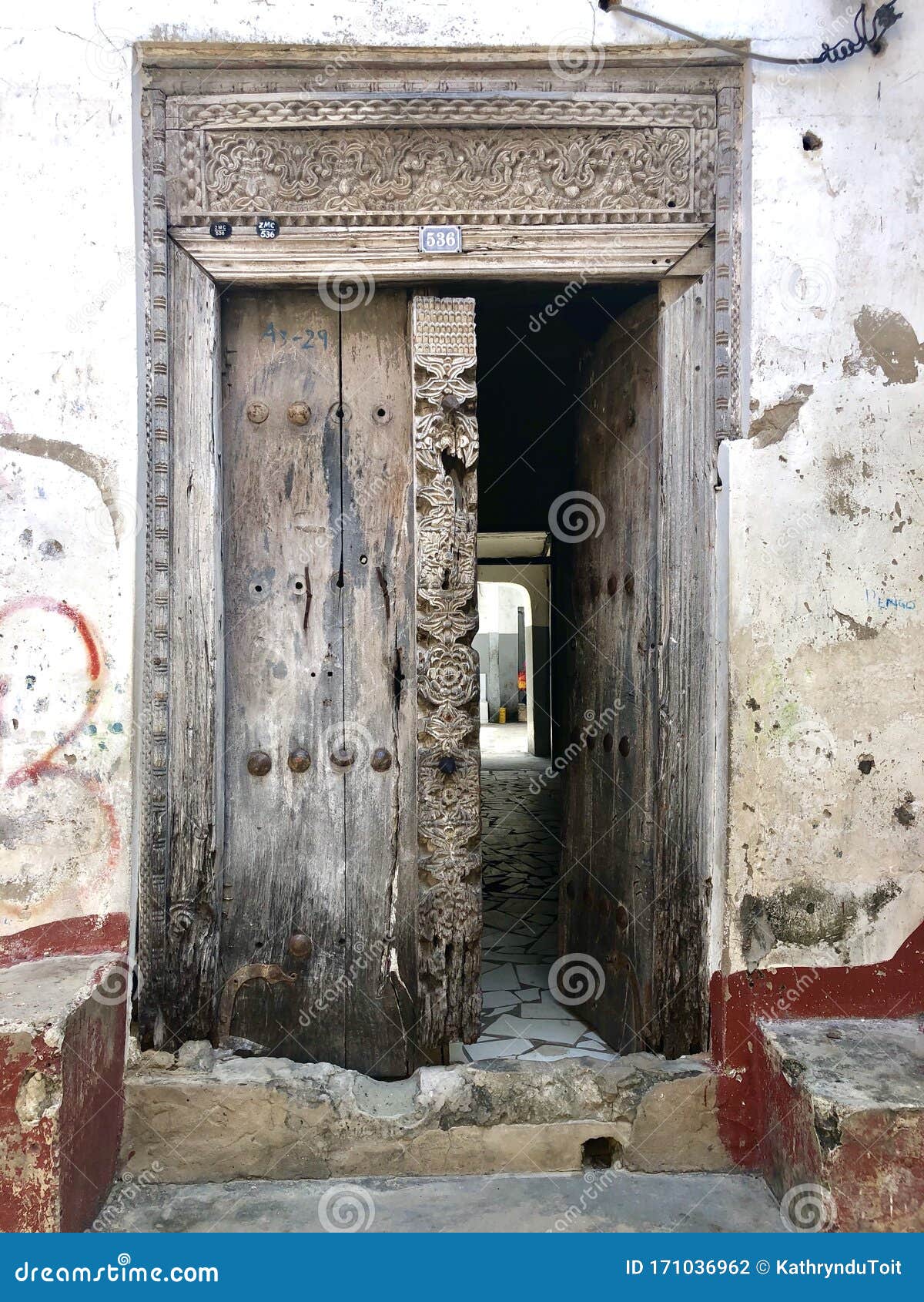 Carved wooden doors of stone town Stock Photo - Alamy