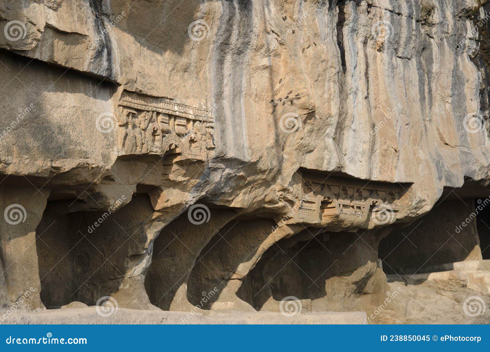 carving details on the outer side of the tulja leni cave, it is the smallest group of caves with 11 caves datable from 1st centu