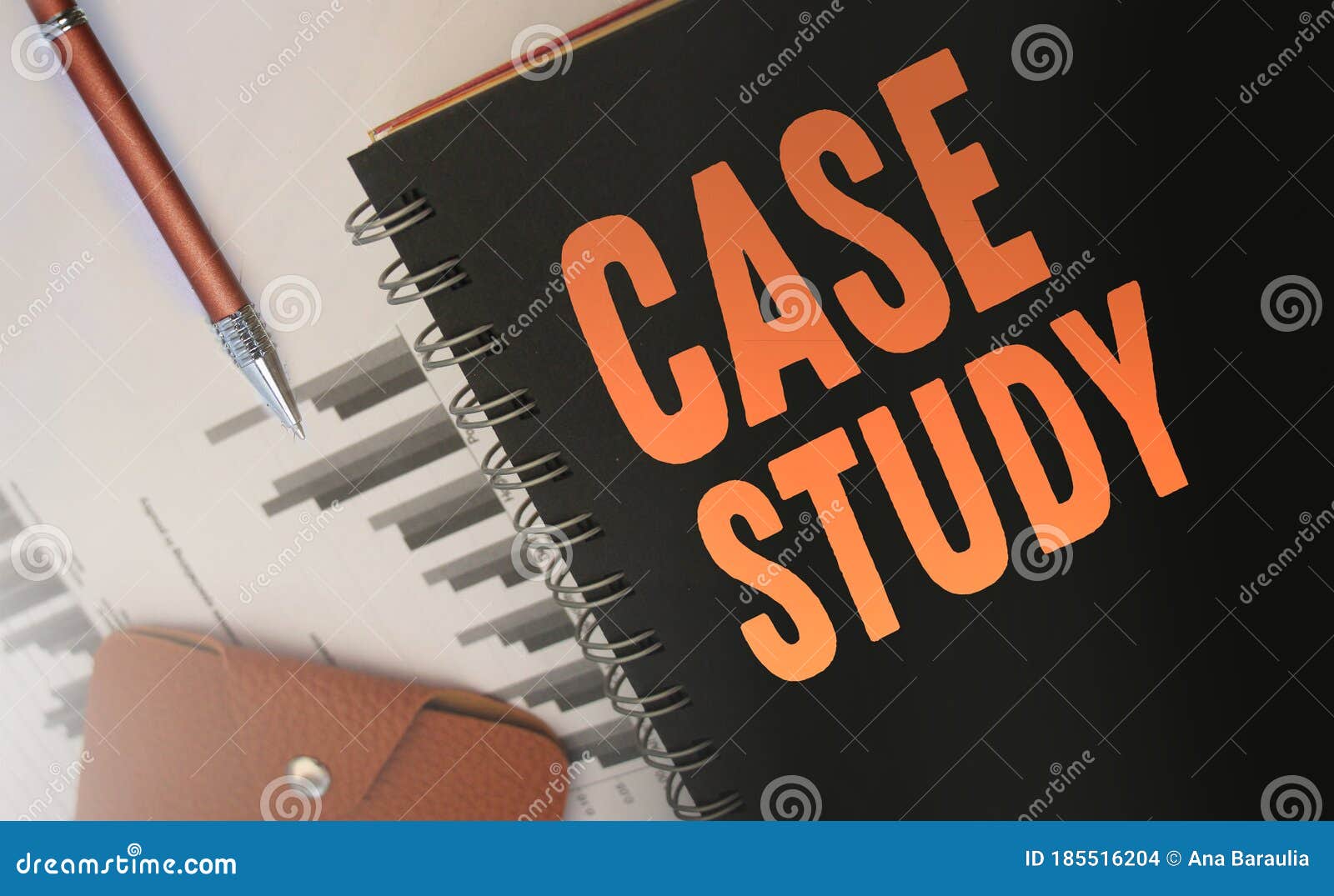case studies text written on a diary cover orange on black. business concept. selective focus