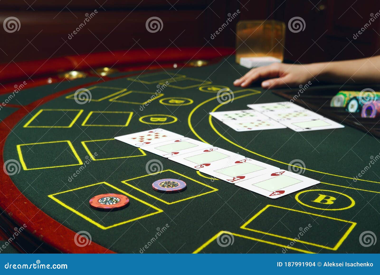 Casino Black Jack Table with Chips and Cards. Hand of Croupier Behind ...