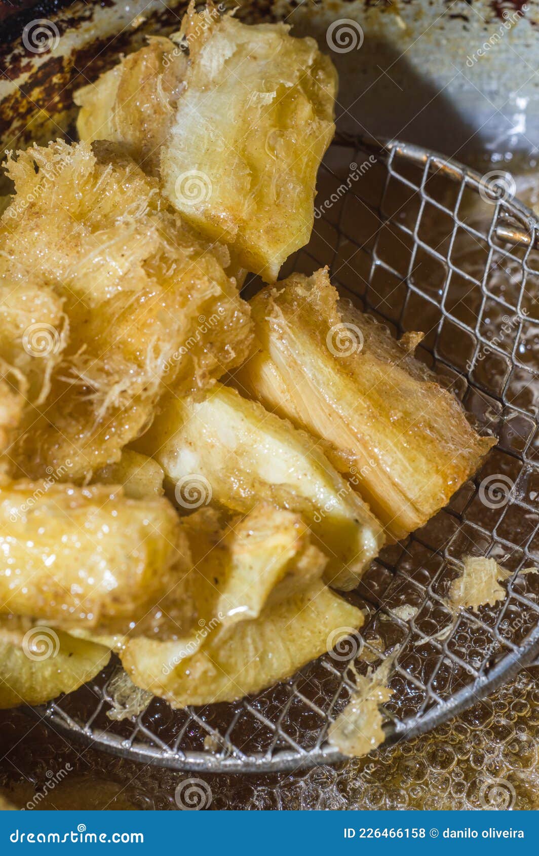 Cassava Being Chilled in Boiling Oil and Bubbling Stock Photo Image