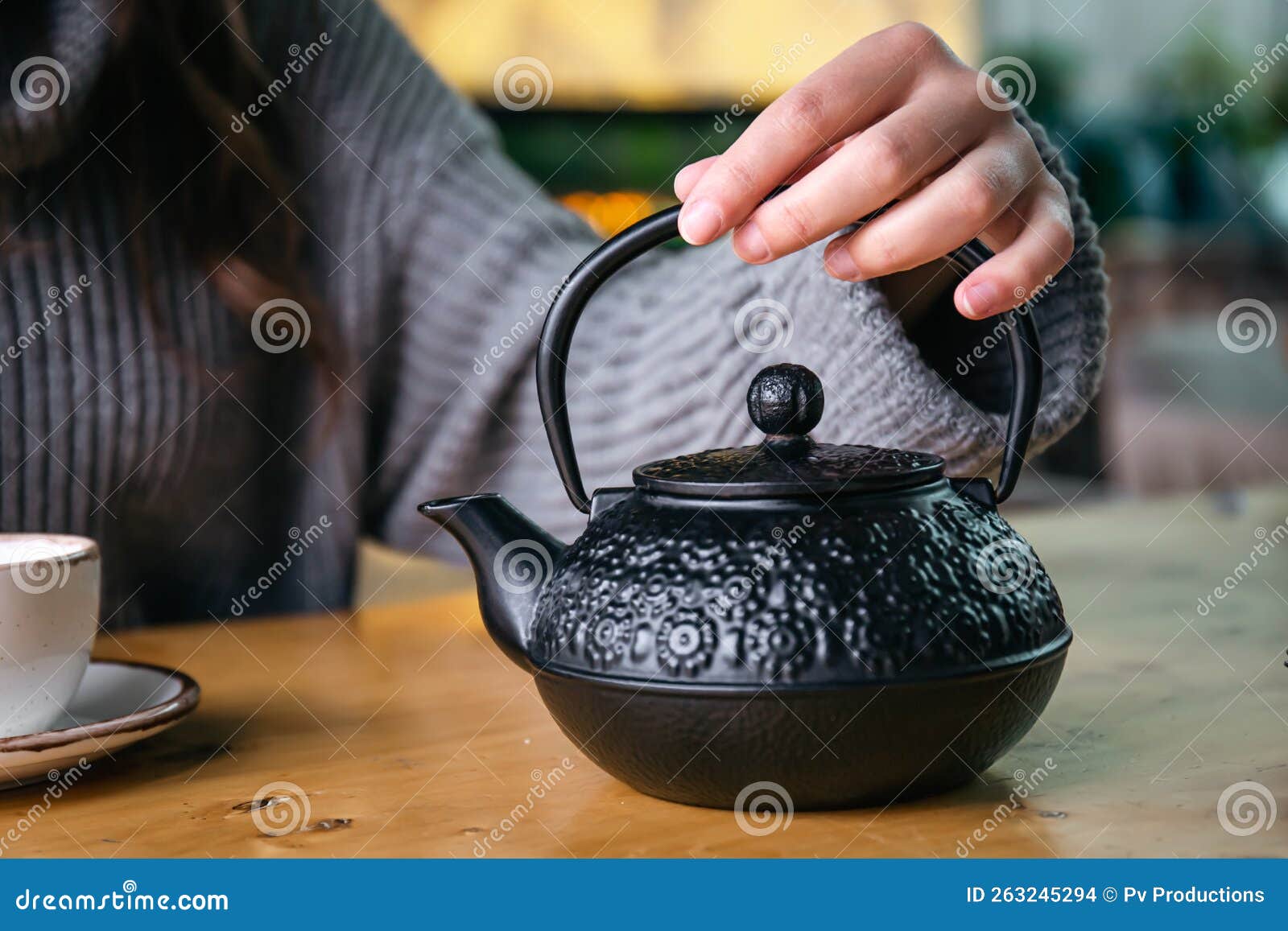 Cast Iron Black Turkish Teapot Closeup on the Table. Stock Photo