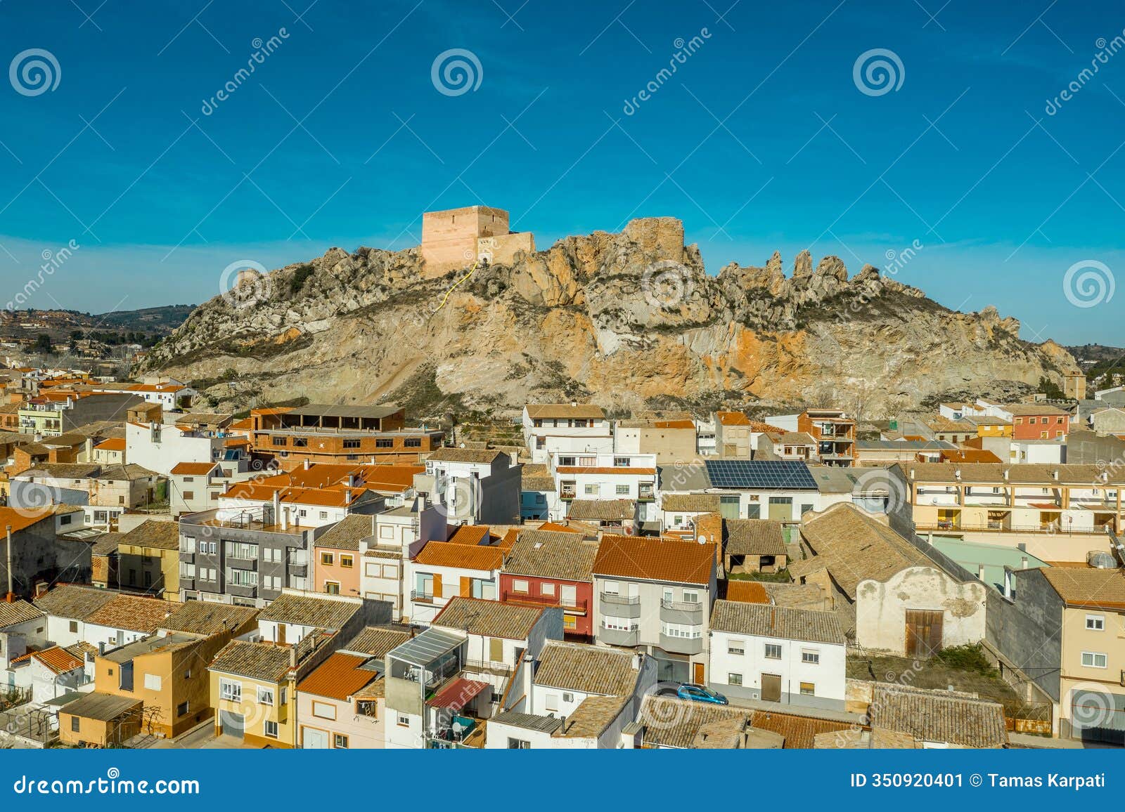 aerial panoramic view of medieval ayora castle of arab origin currently under restoration above the town in spain