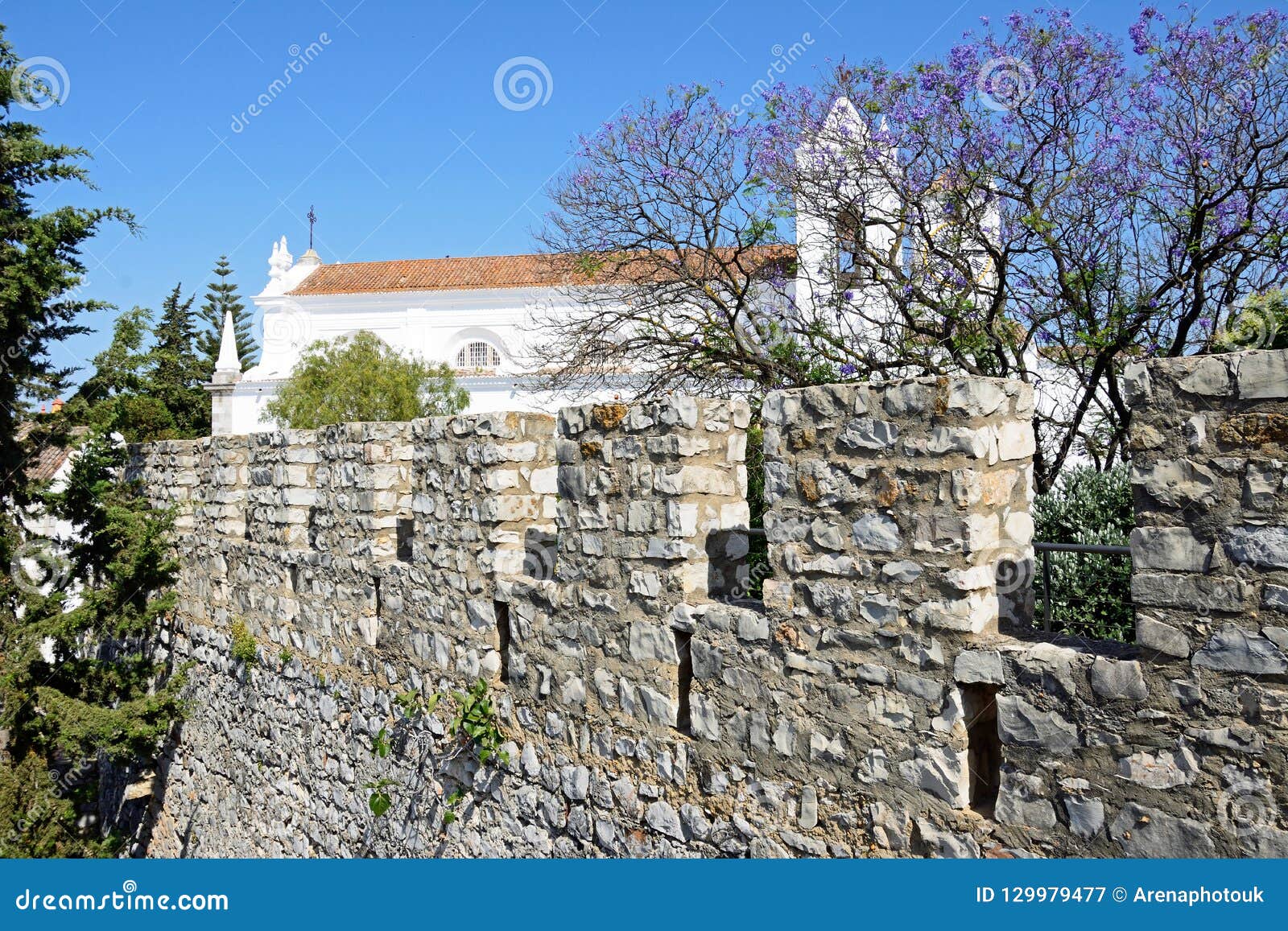 castle battlements and church, tavira.