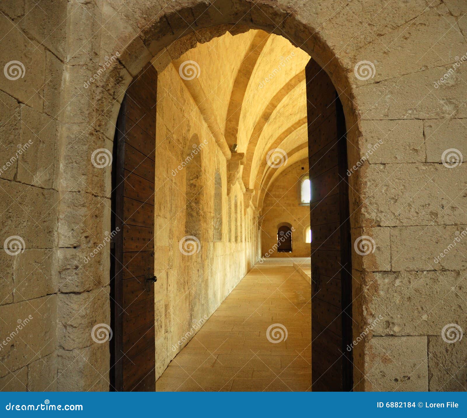 Interior view through a castle doorway.