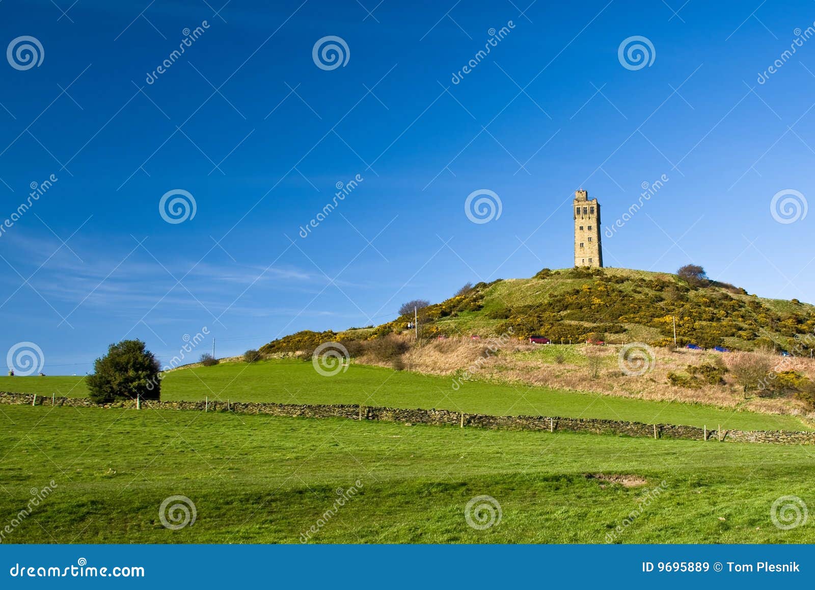 Castle On The Hill Beneath A Rainbow At Sunset Stock Photography