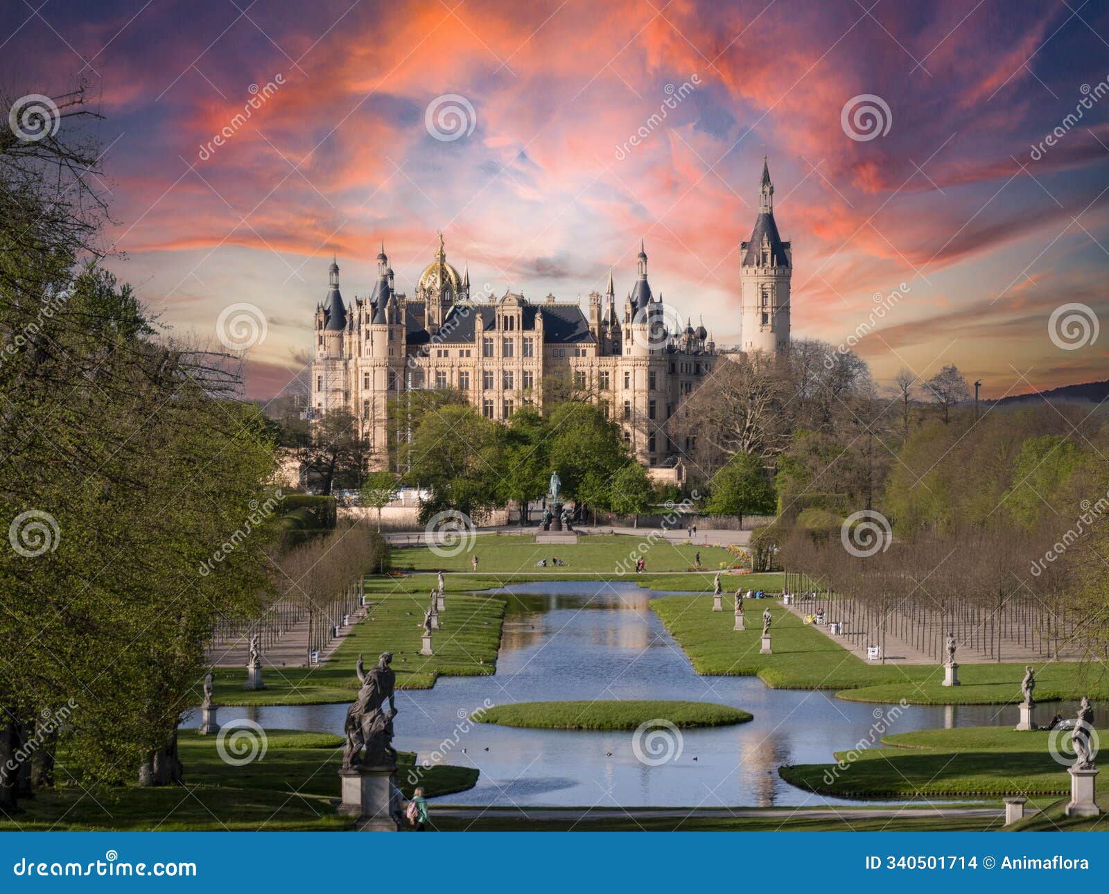 castle in the park from schwerin, state of mecklenburg-western pomerania at sunset