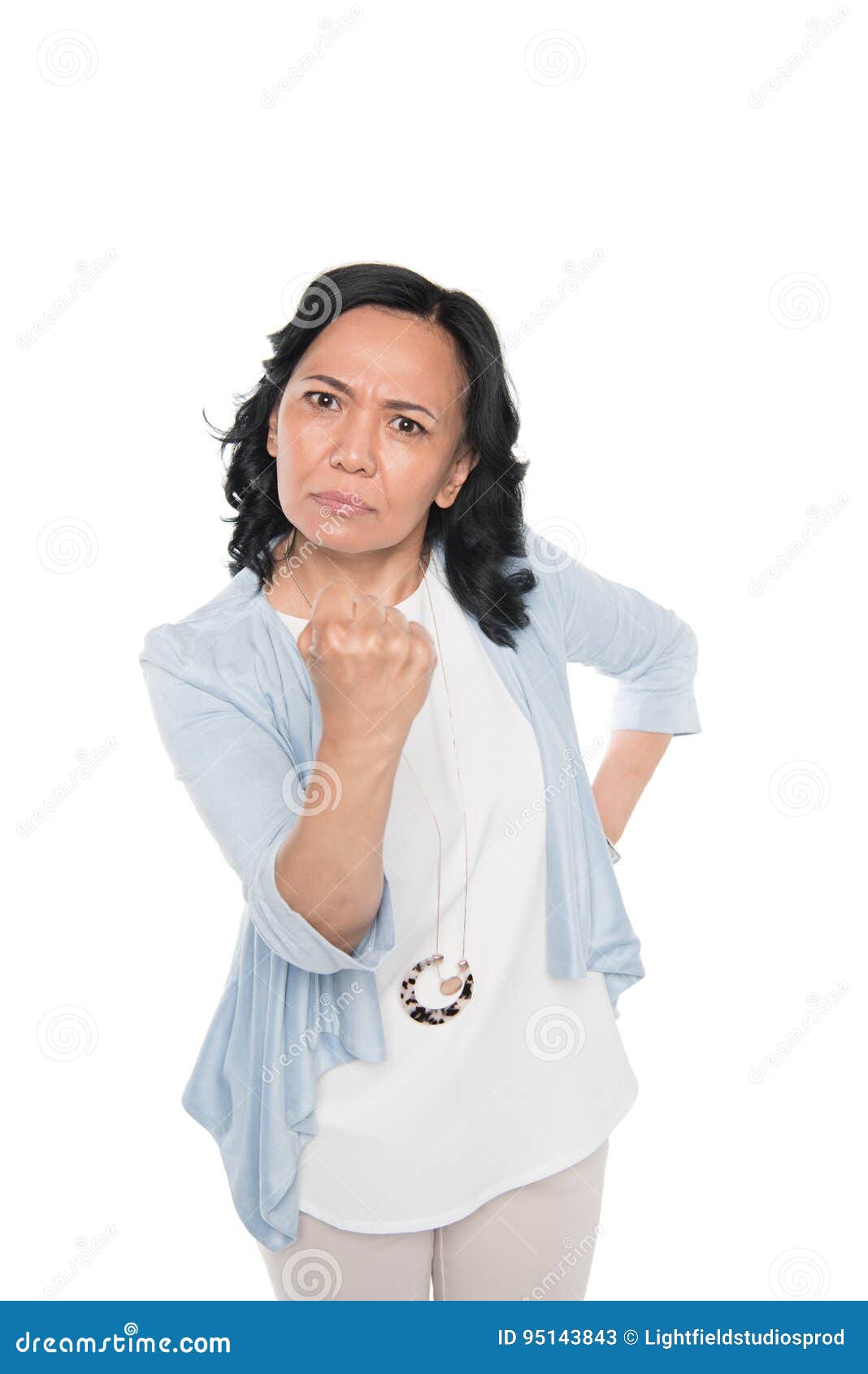 casual asian woman menace with fist  on white