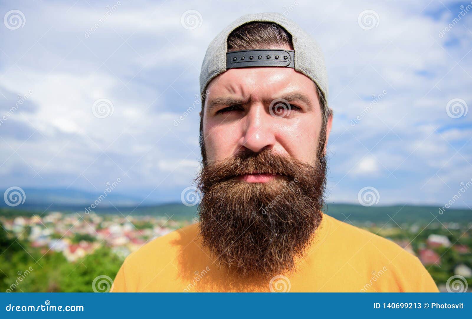 casual chic. cool hipster. bearded man in fashion hipster cap outdoor. brutal man with long beard and mustache. hipster
