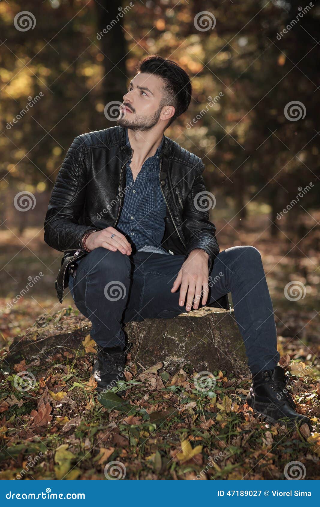 Casual Fashion Man Sitting On A Tree Stump Stock Photo - Image: 47189027