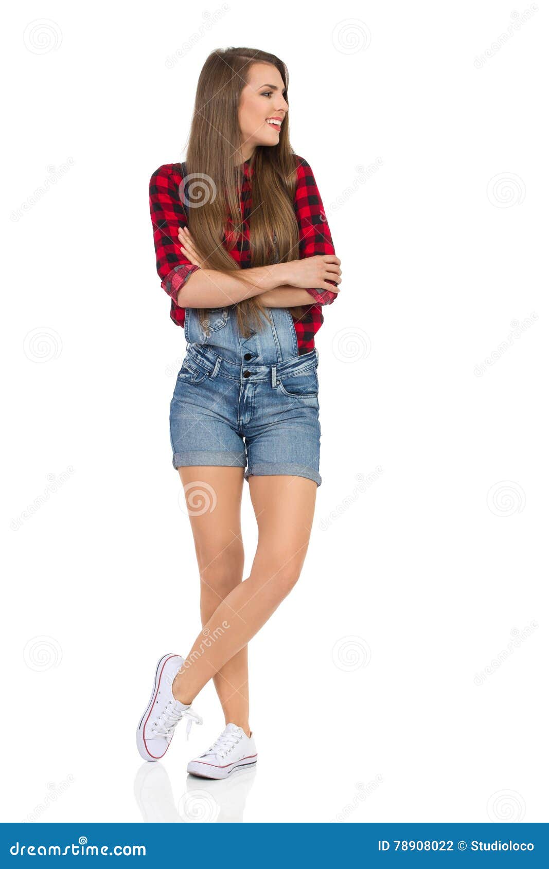 Casual Girl in Dungarees Shorts Watching Stock Photo - Image of arms ...