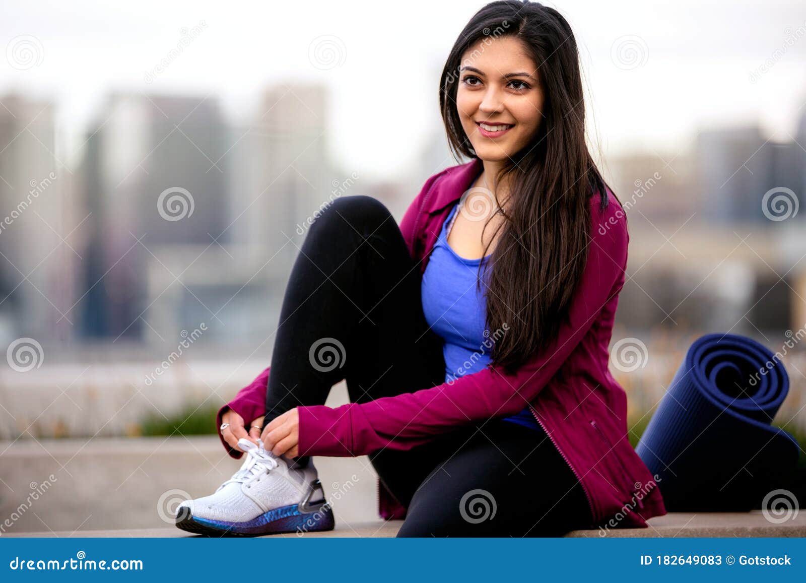 https://thumbs.dreamstime.com/z/casual-lifestyle-portrait-beautiful-indian-american-woman-relaxing-cardio-fitness-exercise-city-skyline-buildings-bac-182649083.jpg