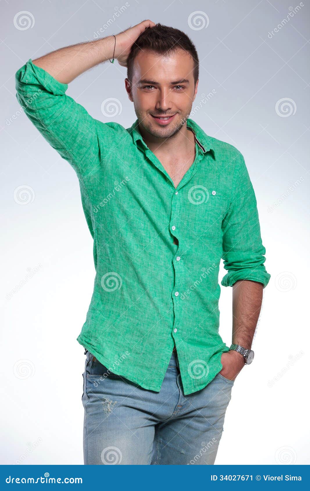 Casual Man With Hand In Pocket Fixes His Hair Stock Image 