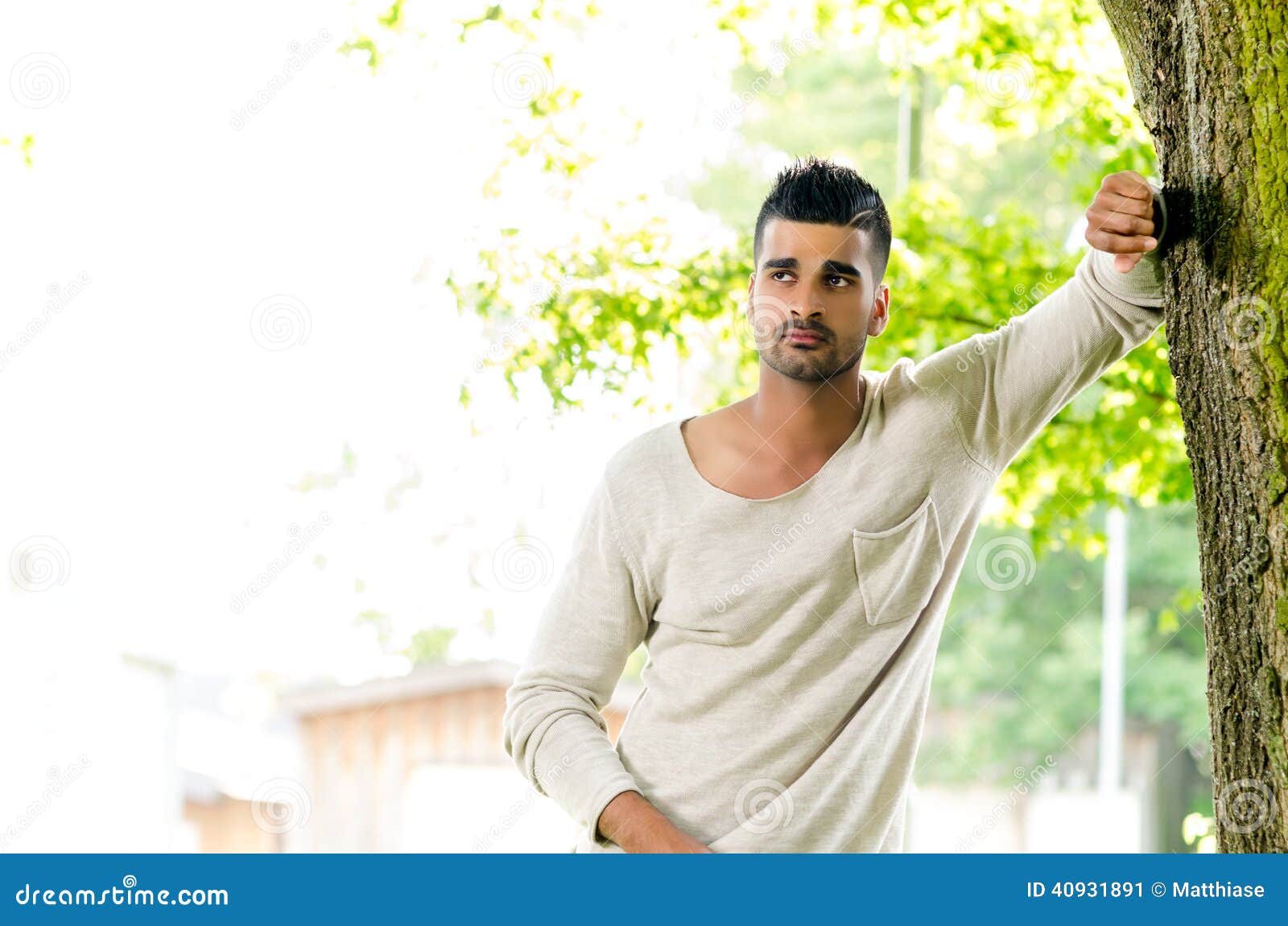 Casual Man Outdoors Leaning on a Tree Stock Image - Image of attitude ...