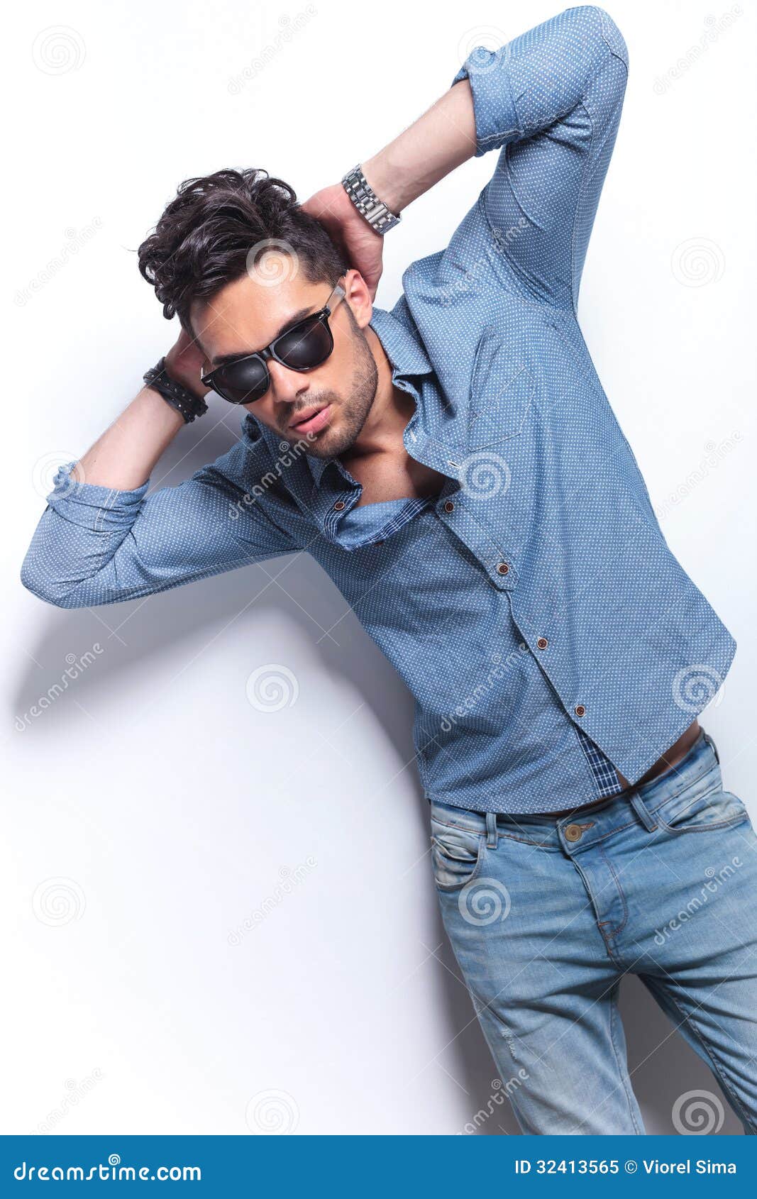 Casual Man Poses With Hands Behind Head Stock Image 