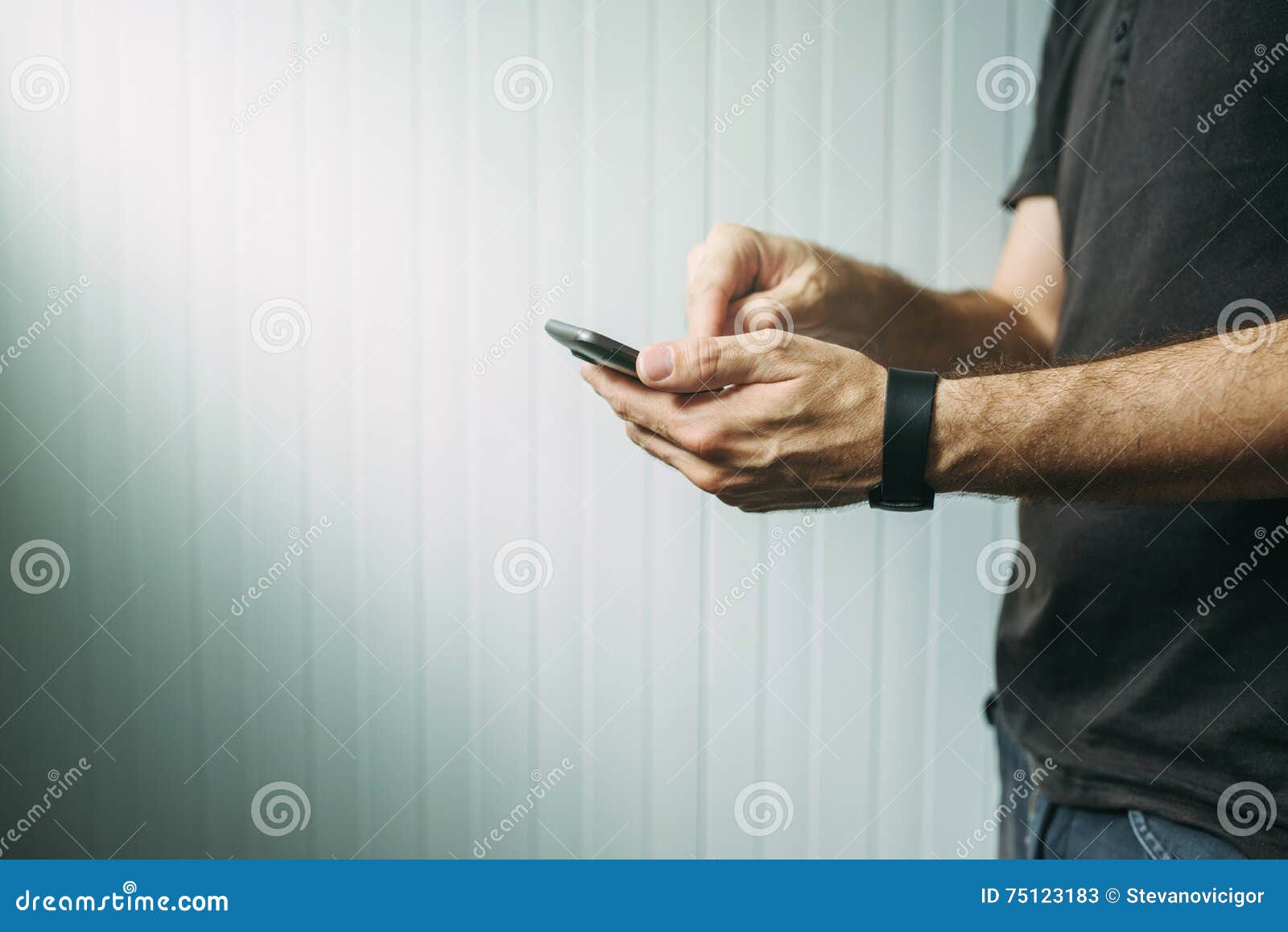 casual man using smart phone to send text message