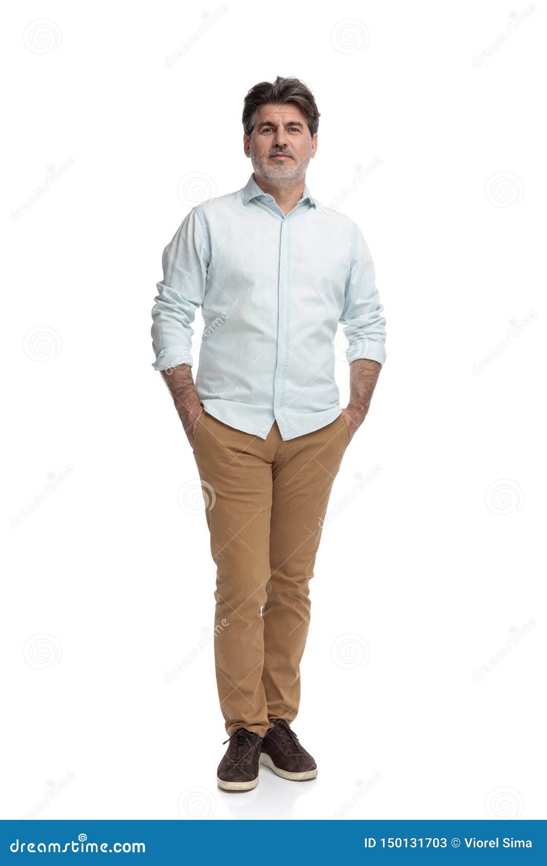 Free Photos - A Well-dressed Young Boy Wearing A White Shirt And Brown Pants.  He Is Posing For A Photo, Showcasing His Outfit And Looking Confident. The  Boy Appears To Be The