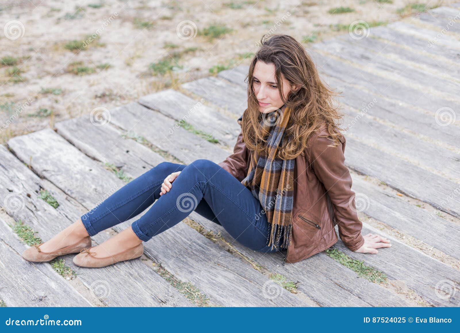 casual outdoors portrait of a beautiful young woman