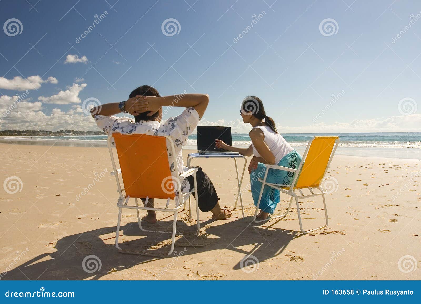 casual workers meeting at the beach