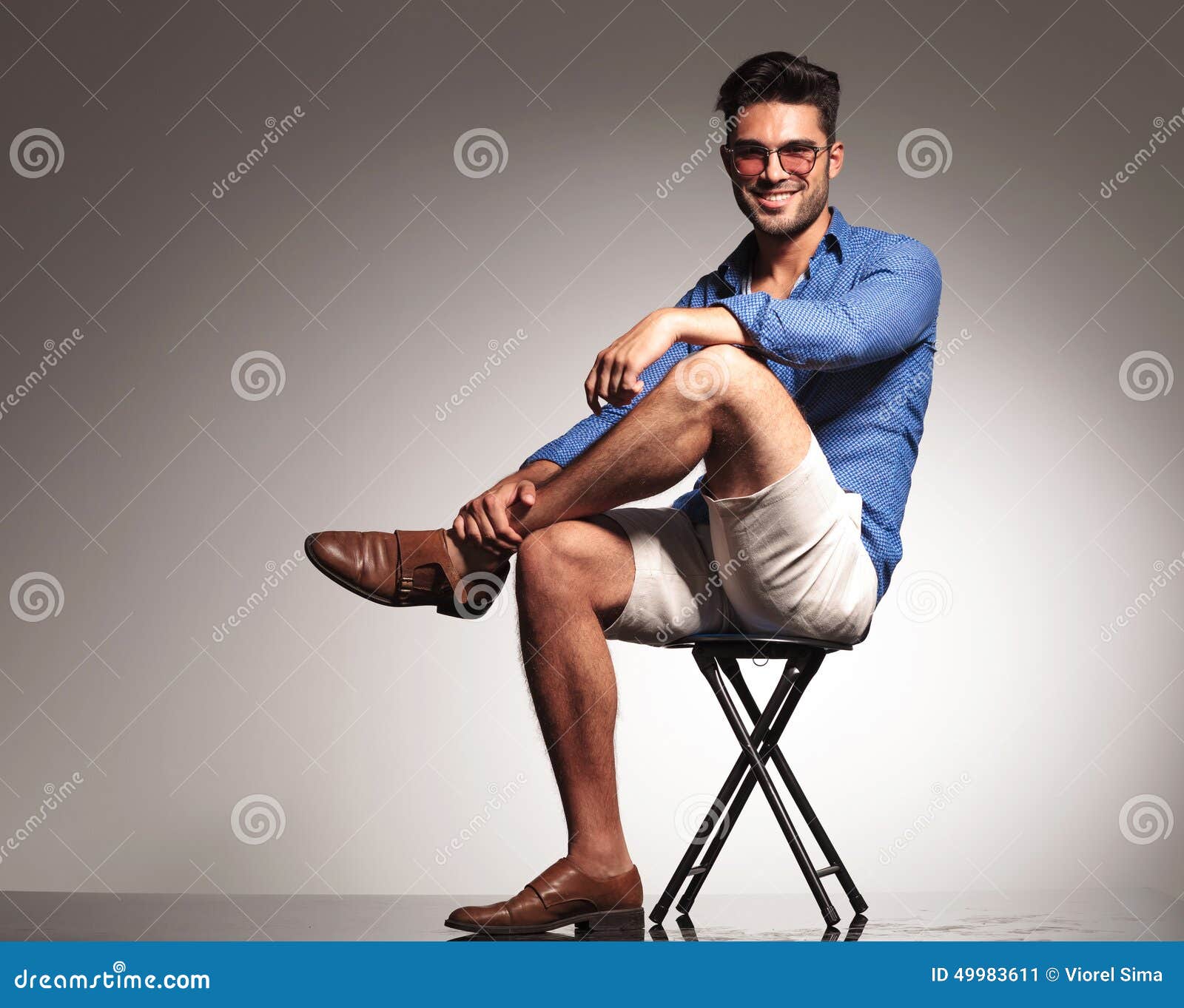 man sitting cross legged side view