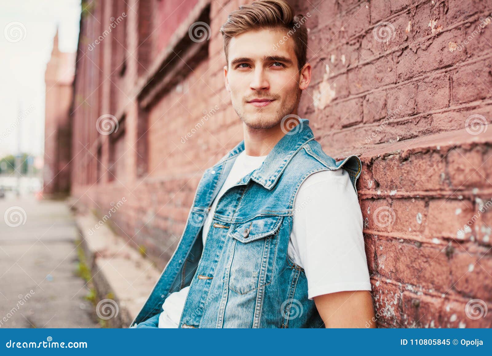 Young Man Standing Against a Brick Wall Stock Image Image of autumn