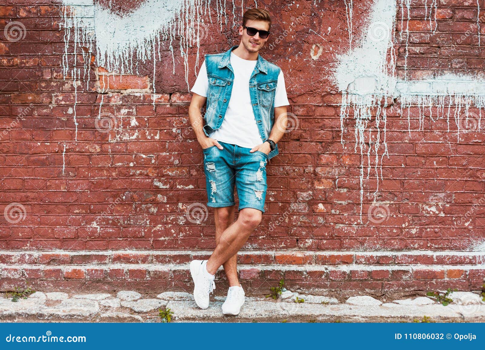 Young Man Standing Against a Brick Wall Stock Photo - Image of plaid ...