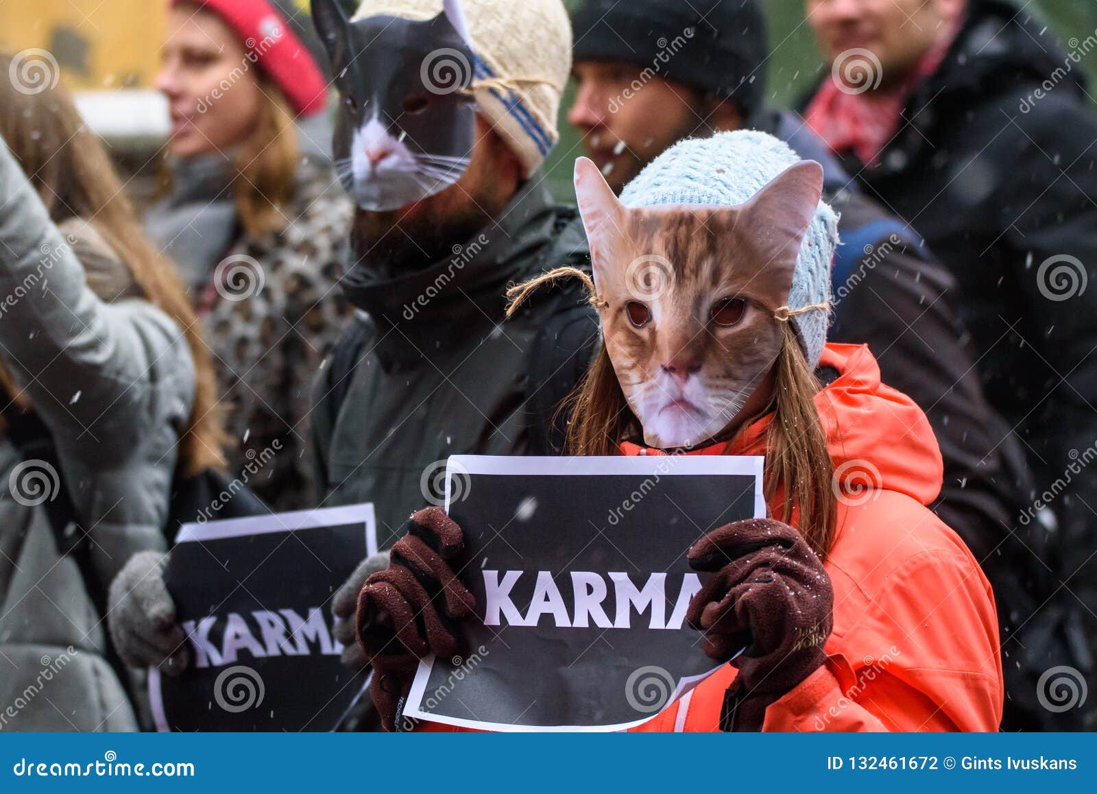 Cat Masks on People Faces with KARMA Sign at Hands, during `March for  Animals` in Riga, Latvia. Editorial Photography - Image of masks, cruelty:  132461672