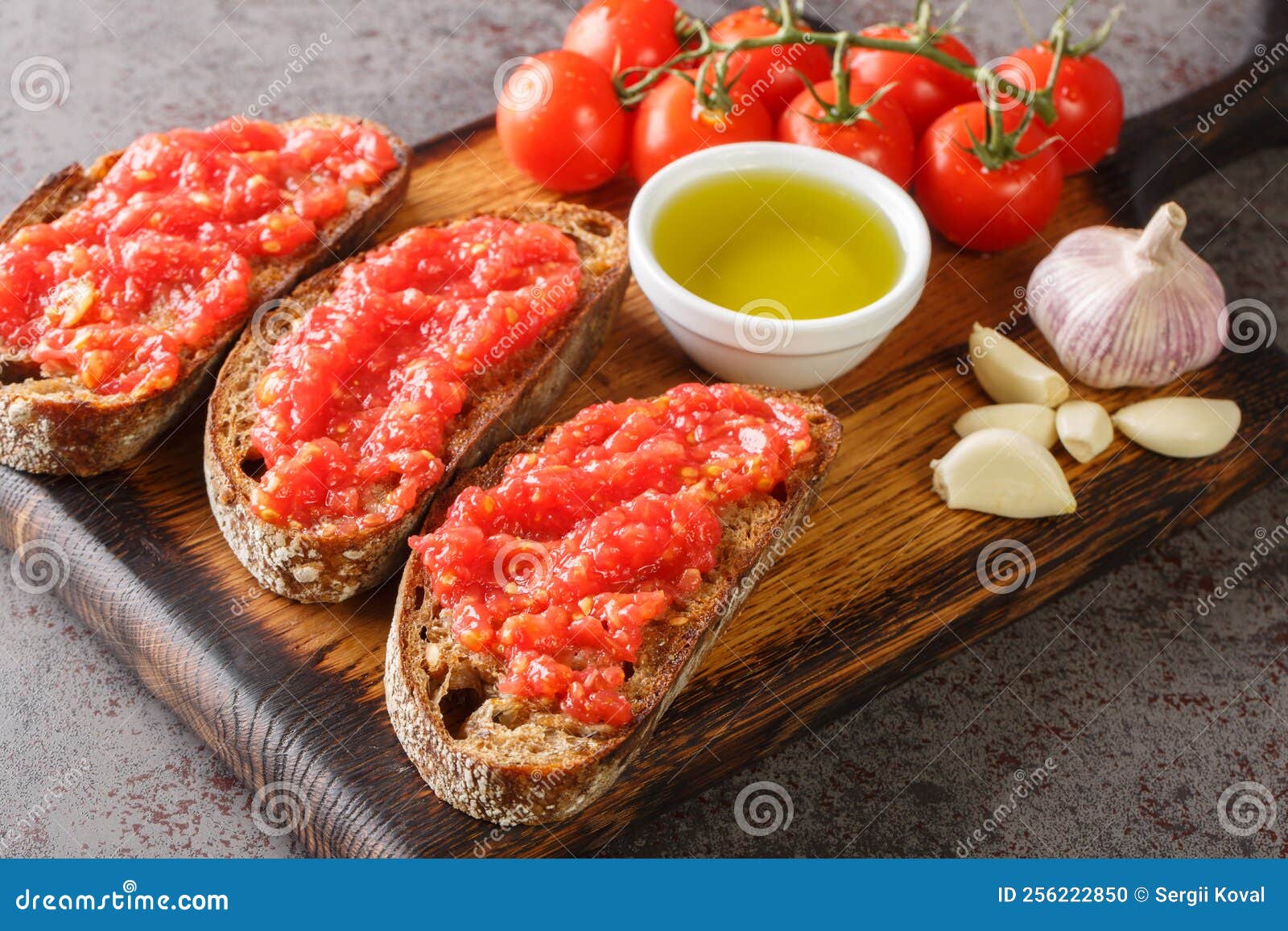 catalan pan con tomate spanish toasted bread rubbed with fresh garlic and ripe tomato, then drizzled with olive oil closeup on the