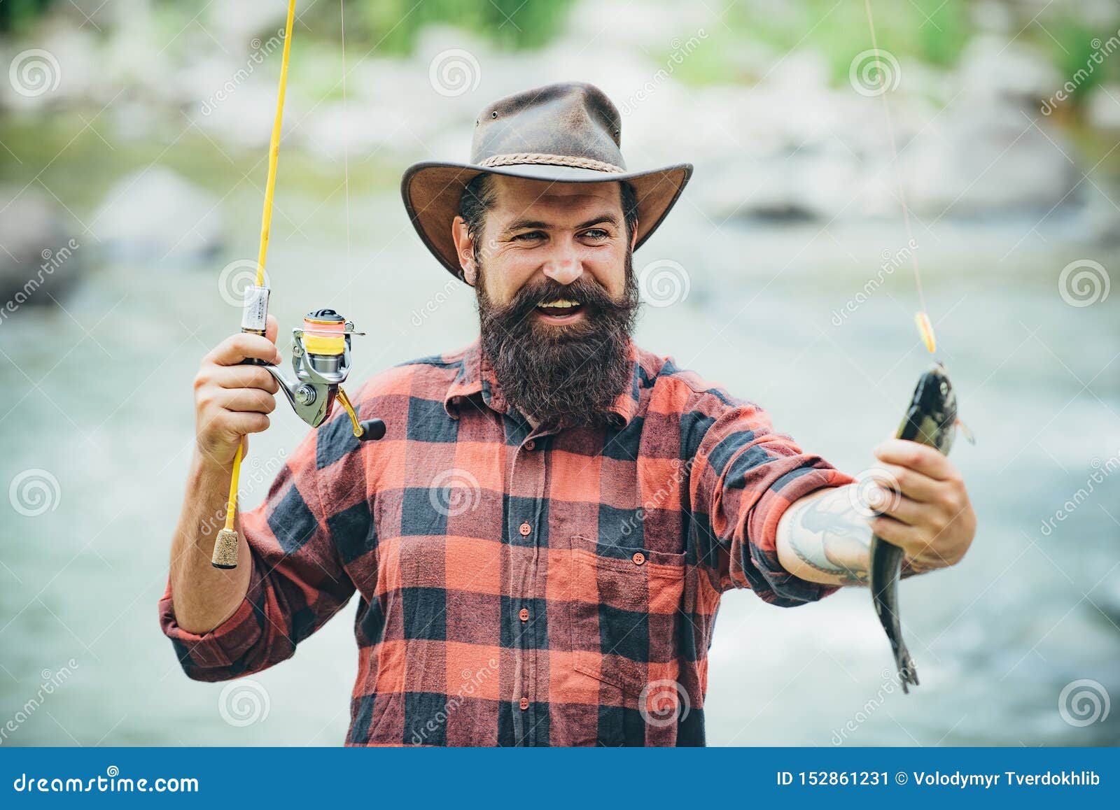 Catching a Big Fish with a Fishing Pole. Fish on the Hook. Fly Fishing.  Holding Brown Trout Stock Image - Image of equipment, beard: 152861231