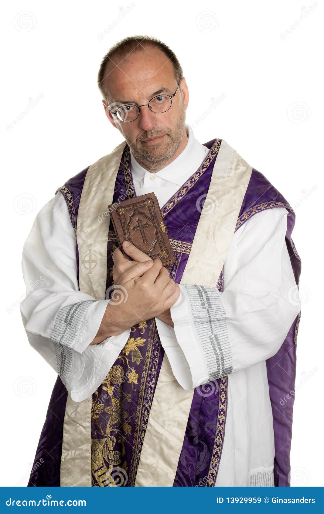 catholic priest with bible in church