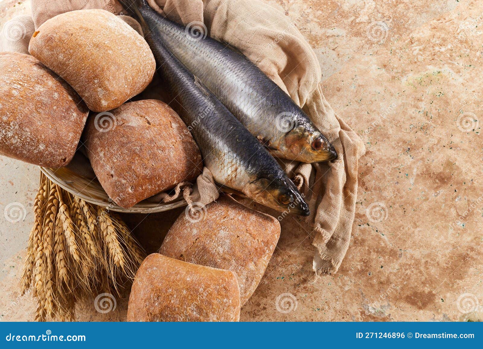 Catholic Still Life of Five Loaves of Bread and Two Fish Stock Photo