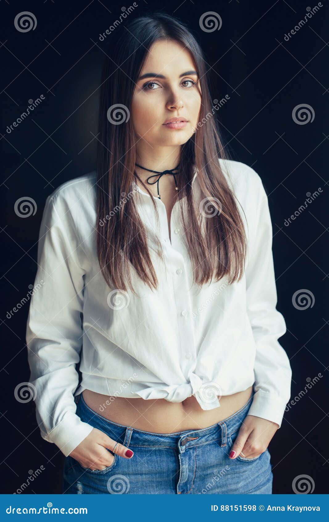 Caucasian Brunette Young Beautiful Girl Woman Model With Long Dark Hair And Brown Eyes In White Shirt Tied In A Knot Blue Jeans Stock Photo Image Of Model Authentic