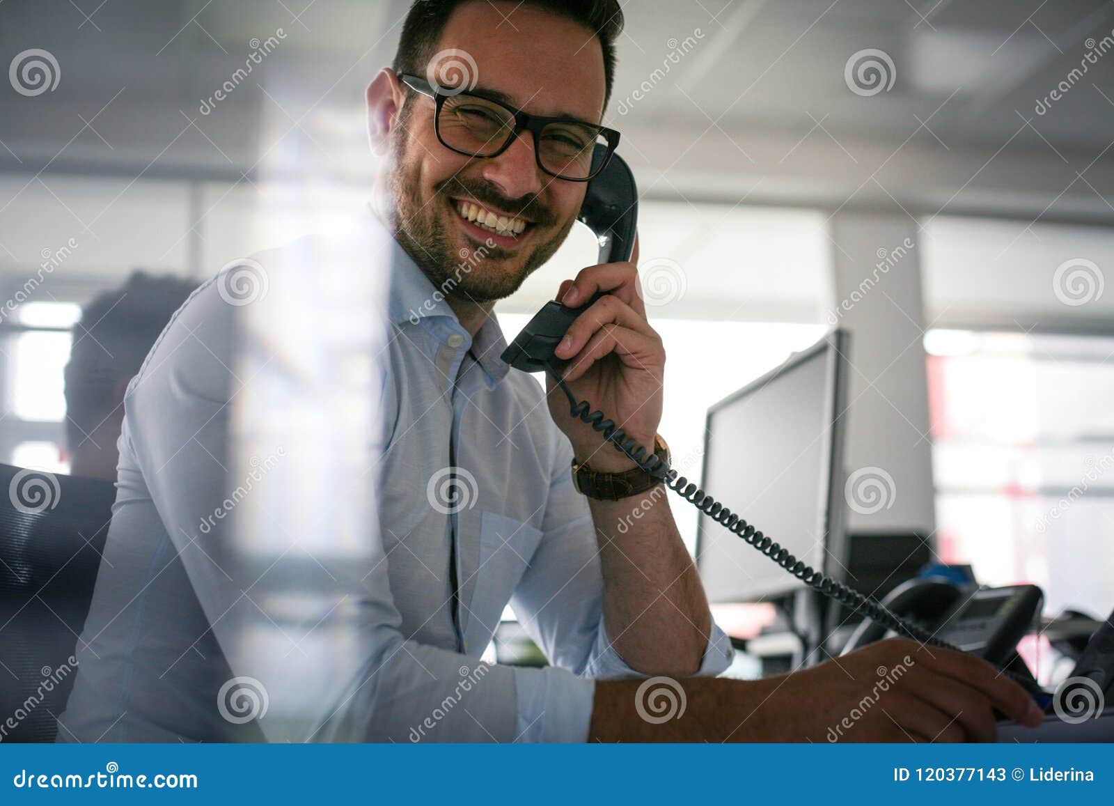 caucasian business man having conversation on landline phone. bu