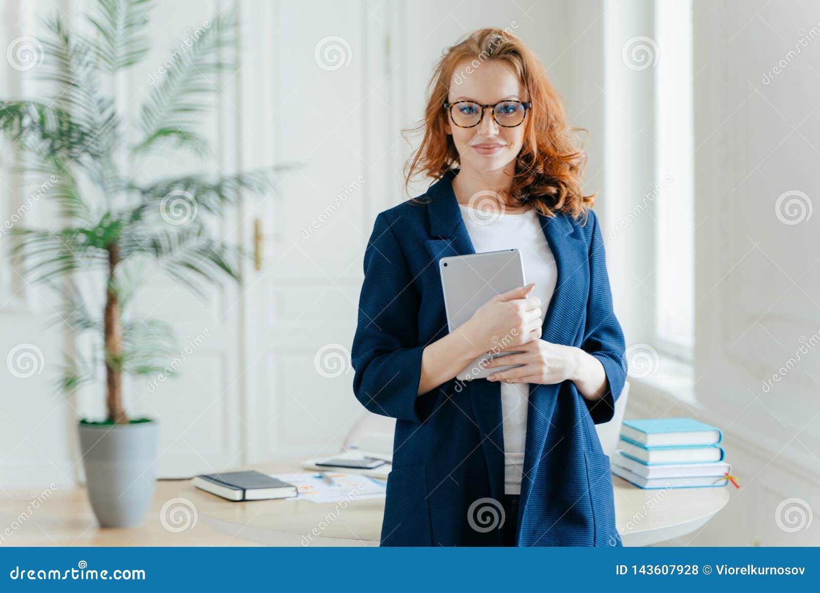 Caucasian Businesswoman Holds Tablet Computer, Checks Balance Account