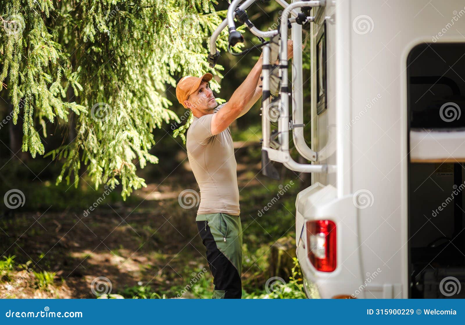 camper van rv owner preparing bike rack