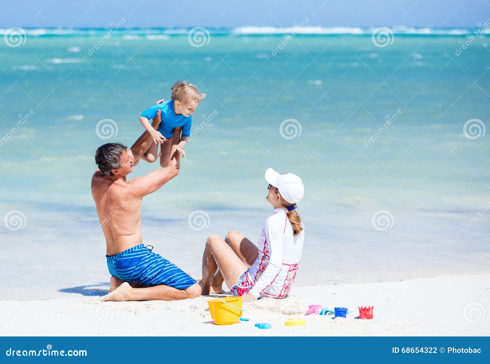 caucasian couple with little son