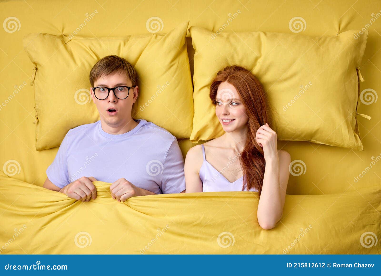 Caucasian Couple Lying In Bed Under Duvet After First Sex Experience Man Is Surprised By Skills